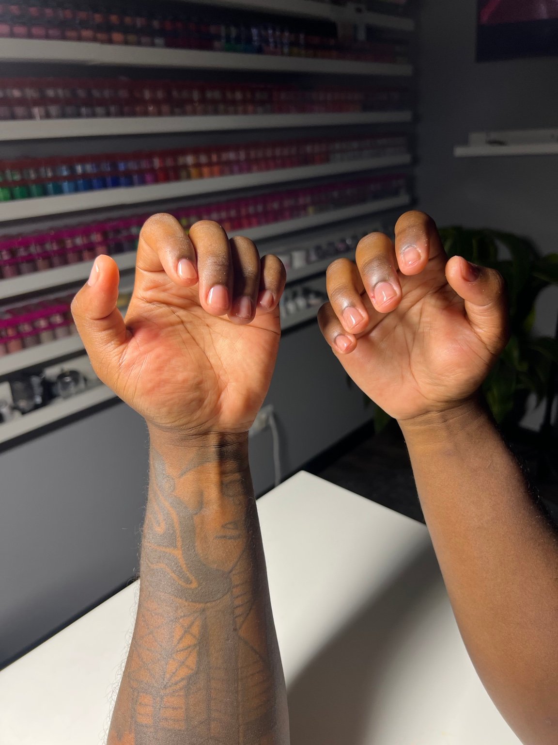 Short nude and pink nails on both hands